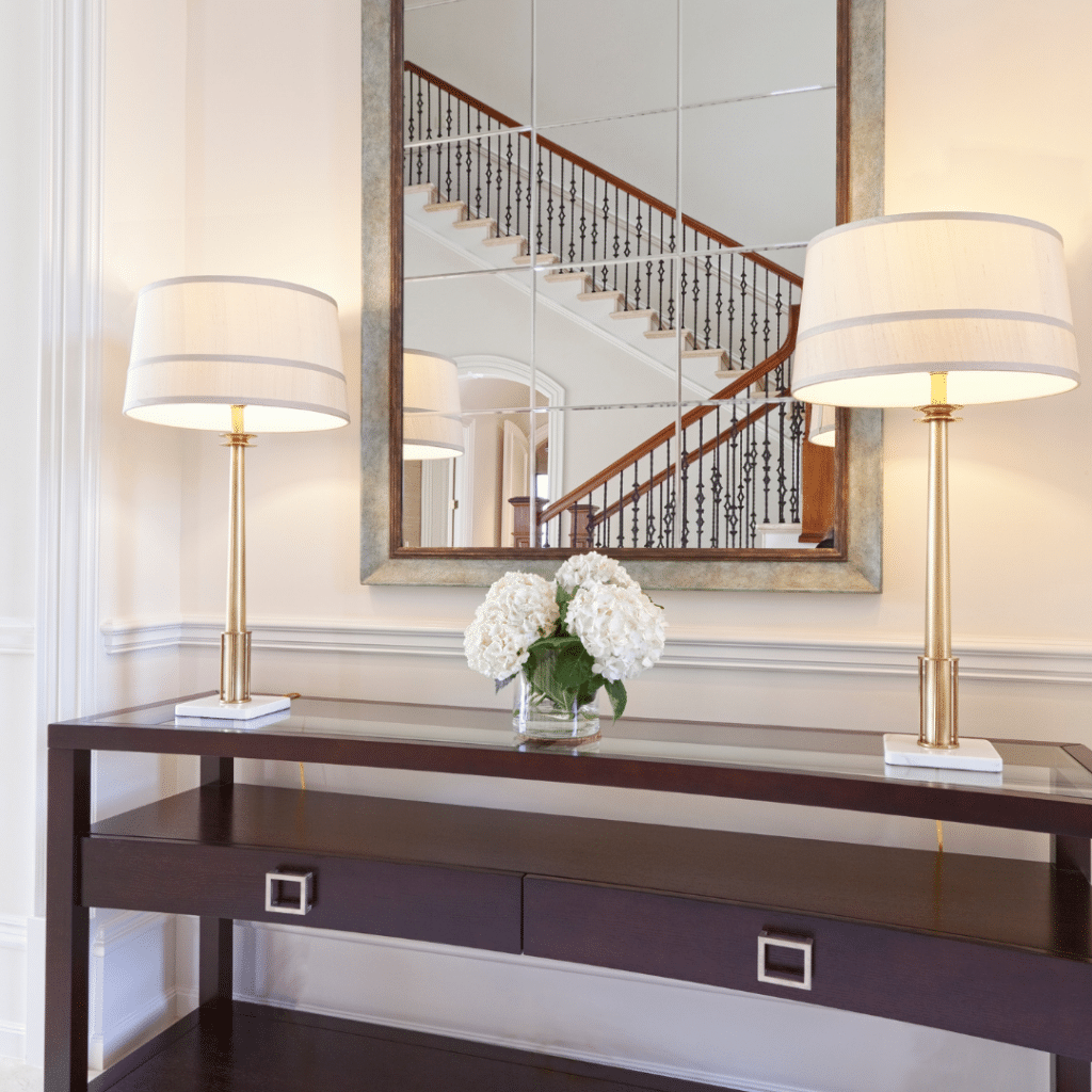 Illustrating the organization idea that a large mirror adds the illusion of space to a small entryway. 