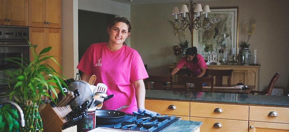 employee cleaning a kitchen